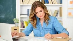 Speak English Fluently tips – teacher writing classroom setting